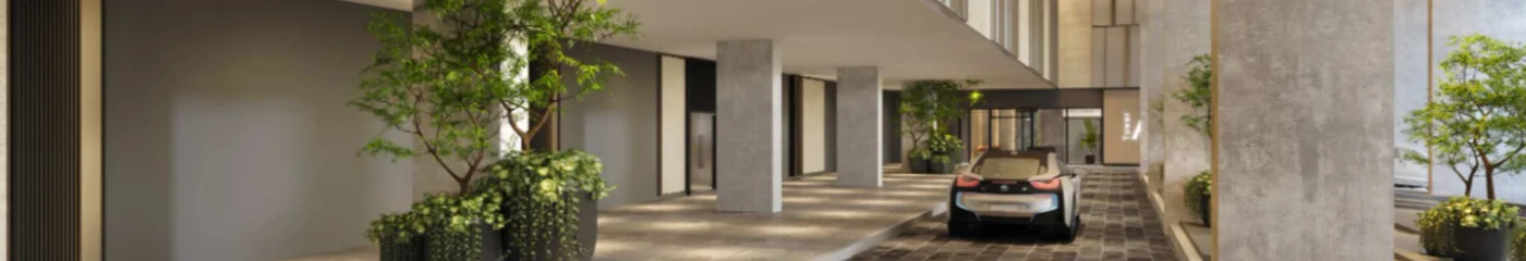 Sky Curve hotel-style covered drop-off and pick-up lobby at Level 1